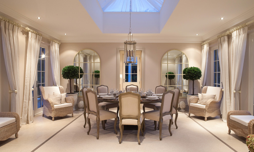 This is an example of a separate dining room in Berkshire with beige walls and carpet.