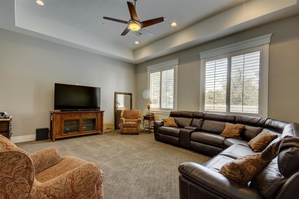 Example of a large transitional look-out medium tone wood floor and beige floor basement design in Phoenix with gray walls