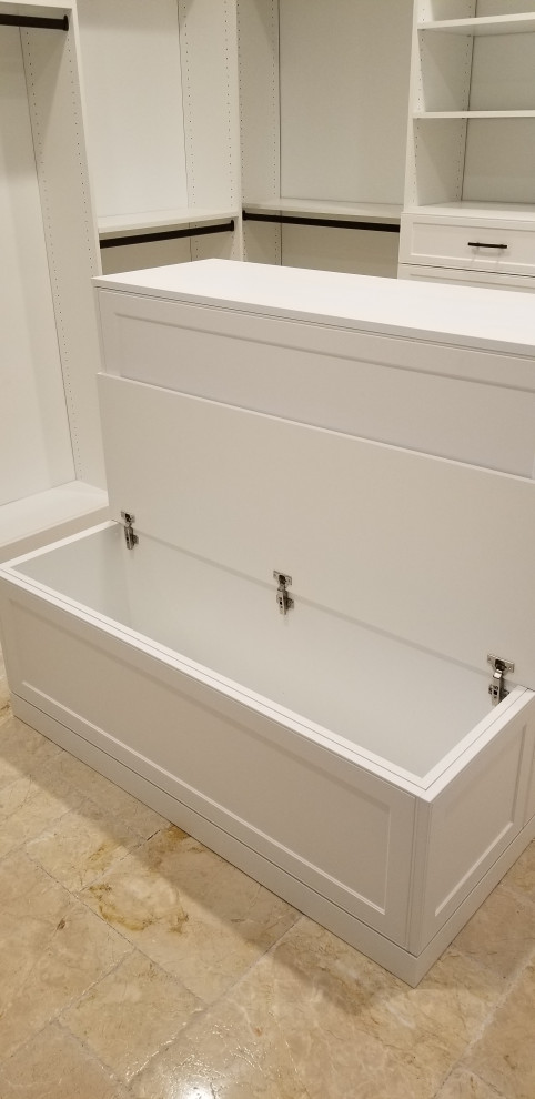 Photo of a large modern gender-neutral walk-in wardrobe with shaker cabinets, white cabinets, porcelain floors and beige floor.