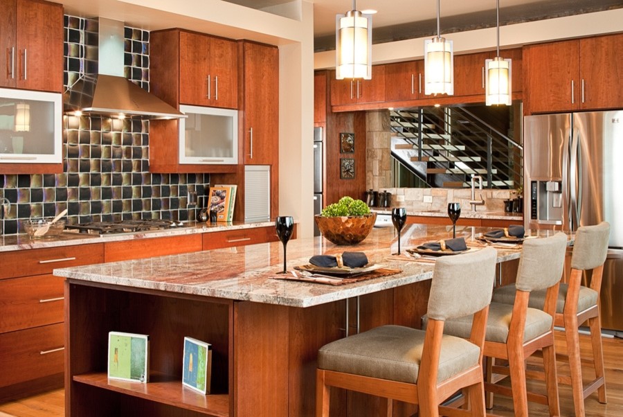Trendy light wood floor kitchen photo in Albuquerque with stainless steel appliances and an island