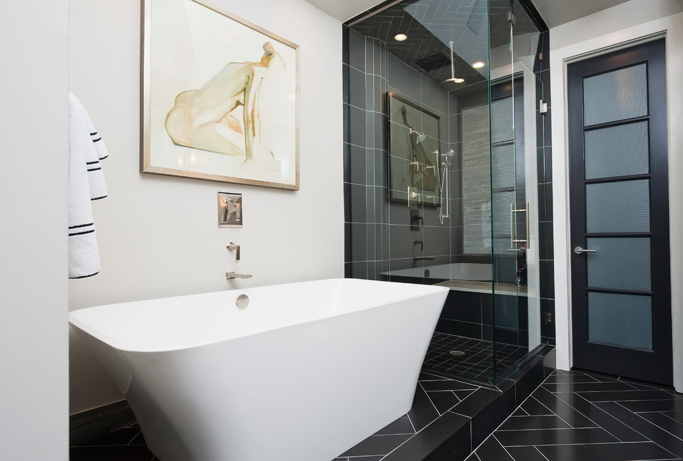 This is an example of a mid-sized contemporary master bathroom in Denver with a freestanding tub, a double shower, black tile, stone tile, grey walls, limestone floors, an undermount sink and quartzite benchtops.
