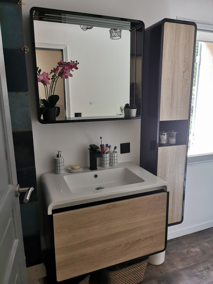 This is an example of a small modern 3/4 bathroom in Paris with light wood cabinets, a wall-mount toilet, white tile, ceramic tile, white walls, medium hardwood floors, an undermount sink, white benchtops, a single vanity and a floating vanity.