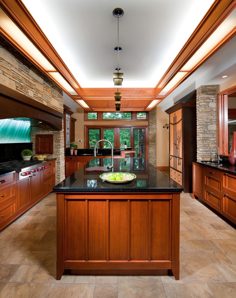 Photo of a large asian u-shaped separate kitchen in Other with an undermount sink, recessed-panel cabinets, medium wood cabinets, stainless steel appliances, ceramic floors, granite benchtops, green splashback, ceramic splashback, with island and brown floor.