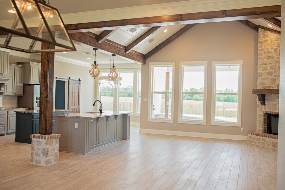 Country ceramic tile and beige floor open concept kitchen photo in Austin with an undermount sink, raised-panel cabinets, gray cabinets, granite countertops, white backsplash, subway tile backsplash, stainless steel appliances and an island