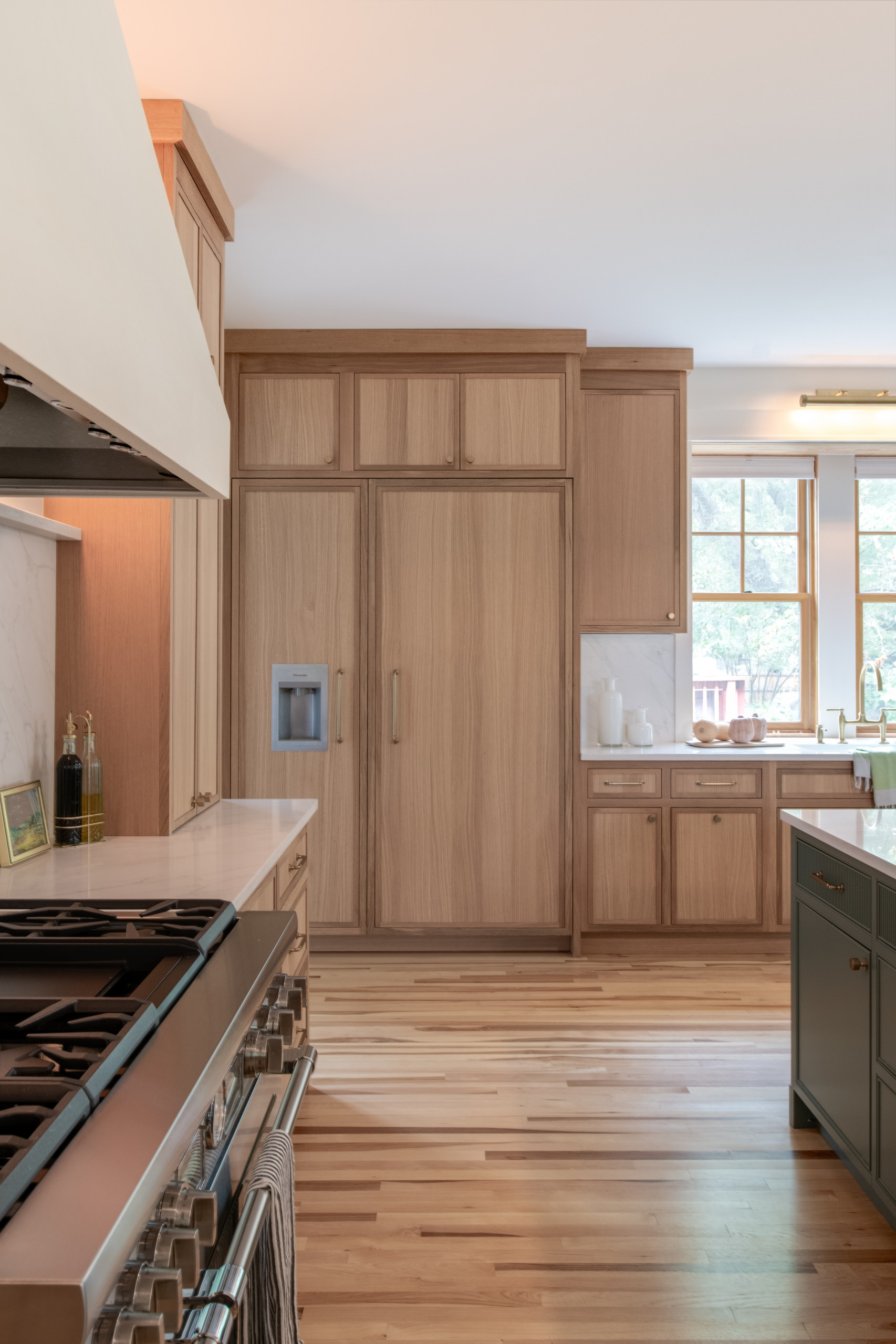 Warm Modern Kitchen Renovation with Natural Oak & Green Accents