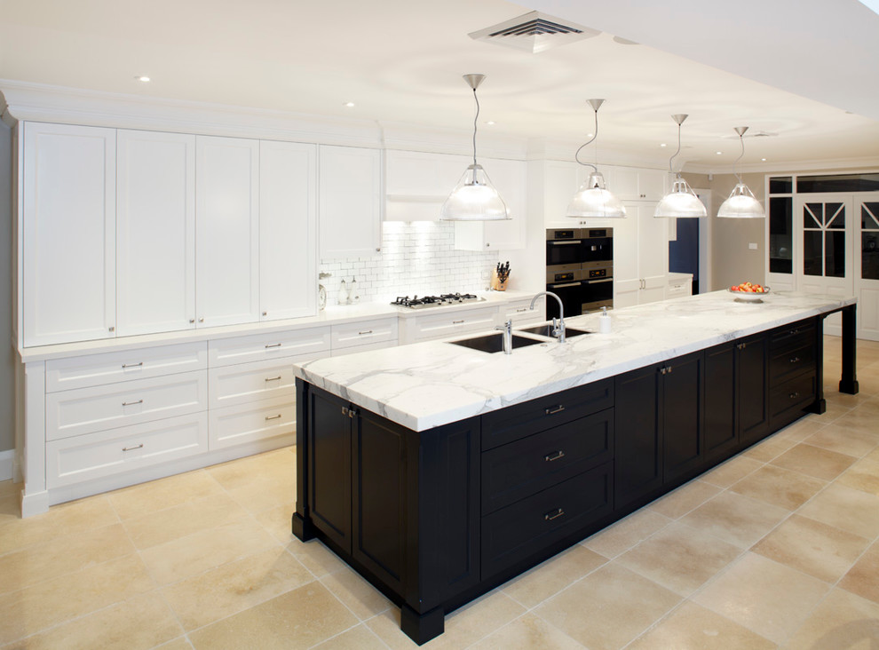 Inspiration for a traditional kitchen in Sydney with marble benchtops and stainless steel appliances.
