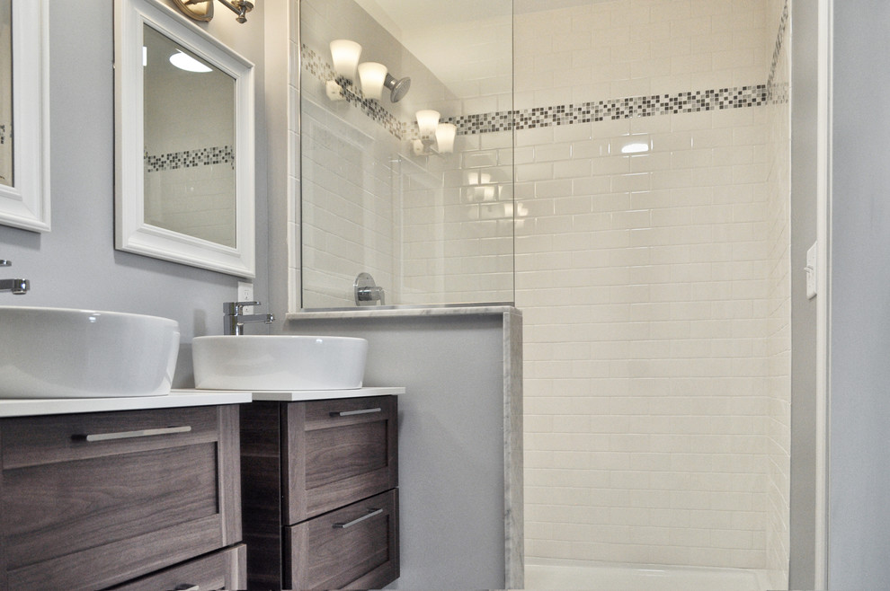 This is an example of a mid-sized transitional master bathroom in Philadelphia with shaker cabinets, distressed cabinets, an open shower, a two-piece toilet, white tile, subway tile, grey walls, a vessel sink and quartzite benchtops.
