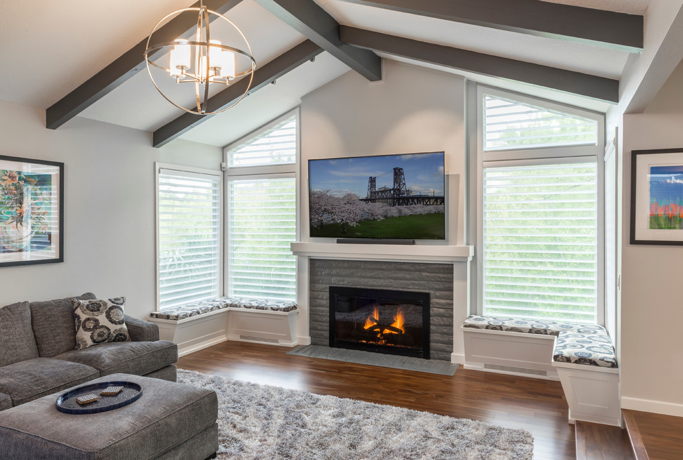 Design ideas for an expansive transitional open concept living room in Portland with grey walls, medium hardwood floors, a standard fireplace, a brick fireplace surround and multi-coloured floor.