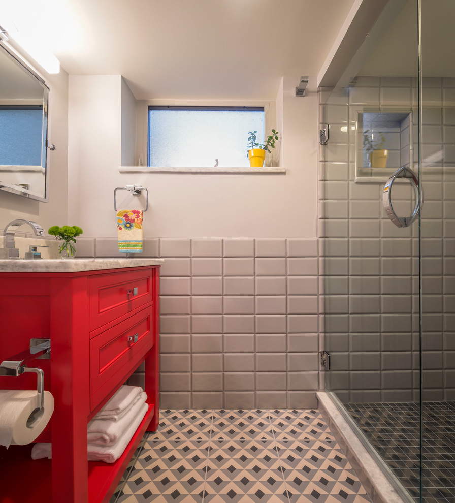 Small contemporary 3/4 bathroom in Denver with furniture-like cabinets, red cabinets, an alcove shower, gray tile, subway tile, grey walls, multi-coloured floor, a hinged shower door, white benchtops, a single vanity and a freestanding vanity.