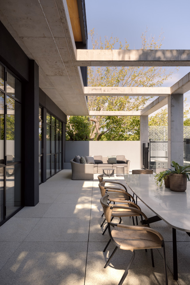 Expansive contemporary patio in Melbourne.