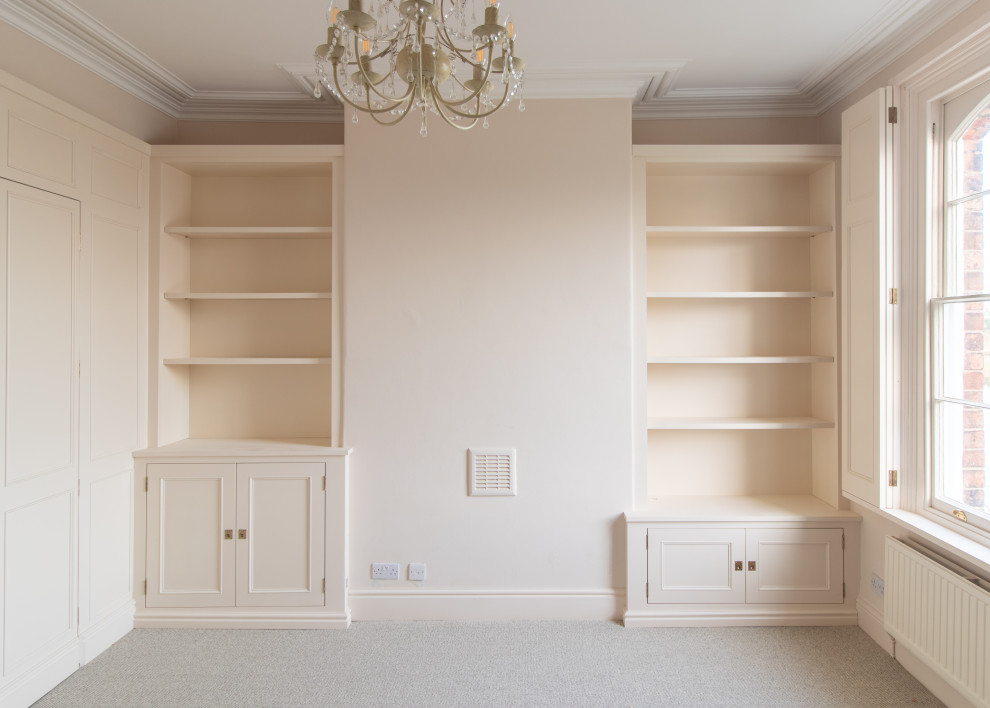 Inspiration for a mid-sized traditional home office in Cheshire with beige walls, carpet and beige floor.