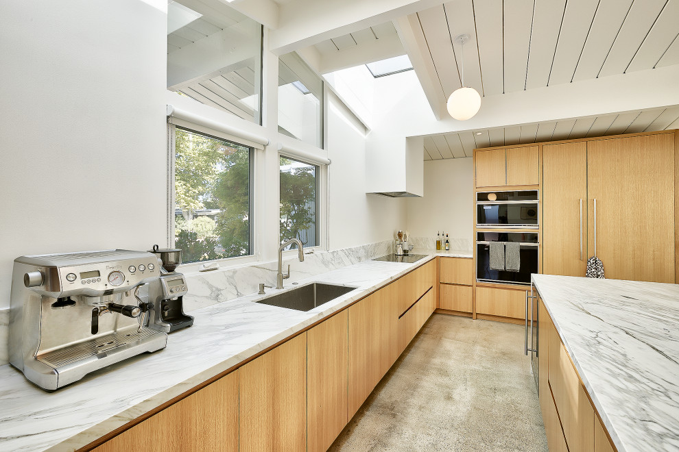 This is an example of a midcentury kitchen in Other.