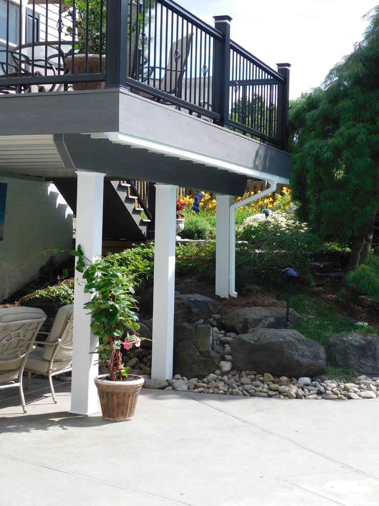 Deck - mid-sized transitional backyard deck idea with no cover