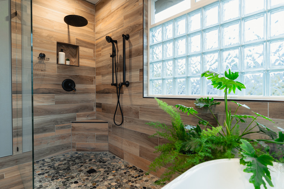 Inspiration for a mid-sized country master bathroom in Seattle with shaker cabinets, brown cabinets, a freestanding tub, a curbless shower, porcelain floors, an open shower, a niche, a double vanity and a built-in vanity.