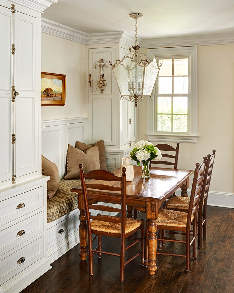 Photo of a traditional dining room in Charlotte with beige walls, dark hardwood floors and no fireplace.