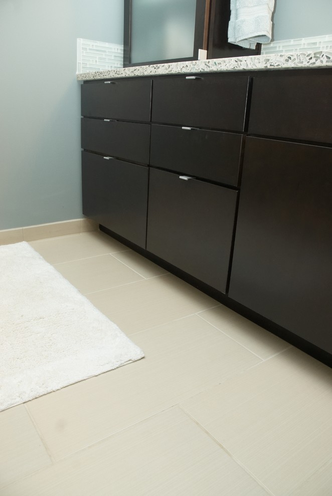 Bathroom - mid-sized transitional 3/4 blue tile, gray tile and matchstick tile porcelain tile and beige floor bathroom idea with flat-panel cabinets, dark wood cabinets, gray walls, a vessel sink and terrazzo countertops