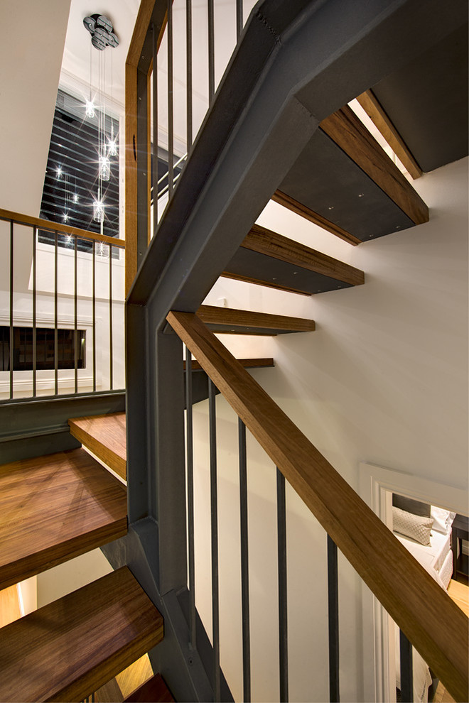 Small modern wood u-shaped staircase in Sydney with open risers.