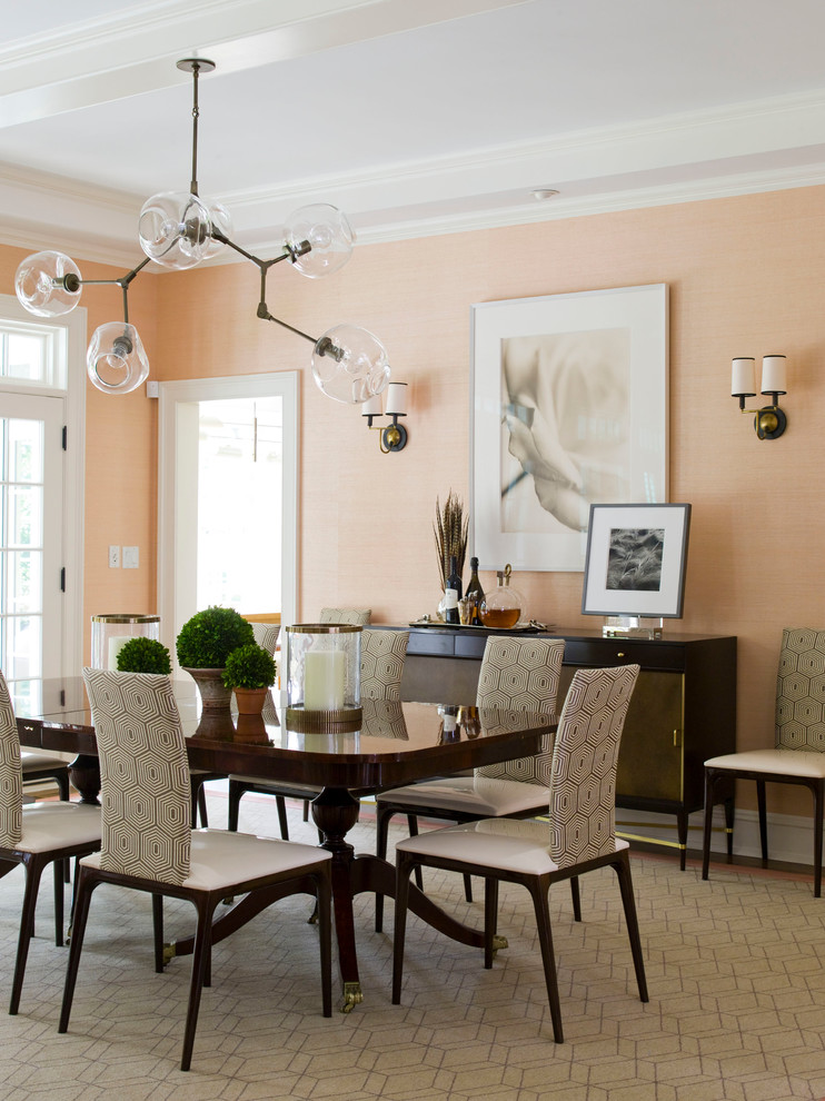 Photo of a large contemporary separate dining room in Dallas with orange walls, carpet and beige floor.