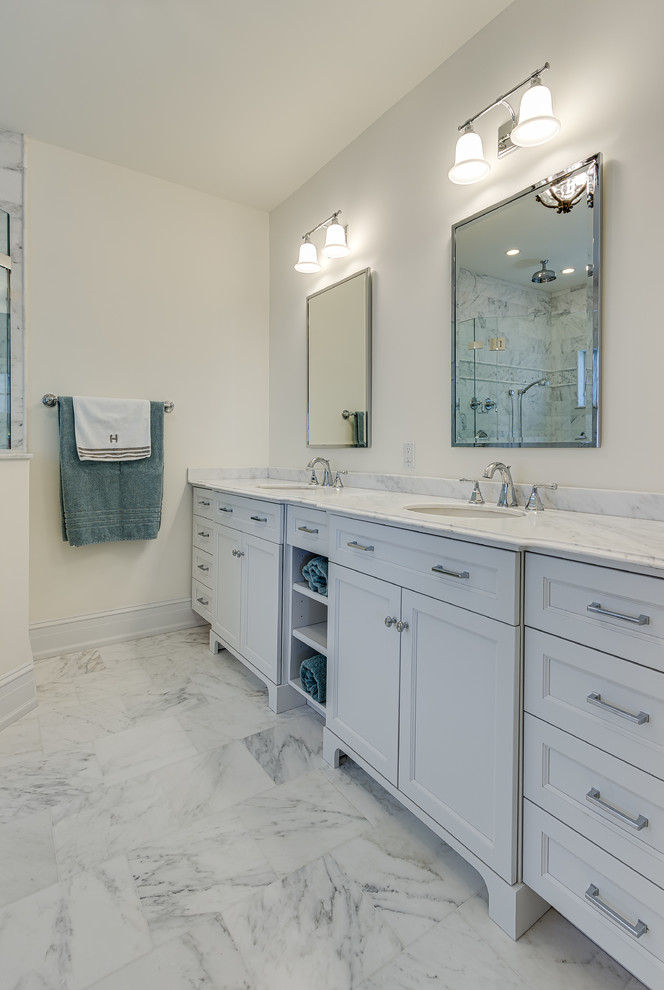 Small beach style master bathroom in Philadelphia with flat-panel cabinets, white cabinets, a one-piece toilet, marble, white walls, marble floors, a drop-in sink, marble benchtops and white floor.
