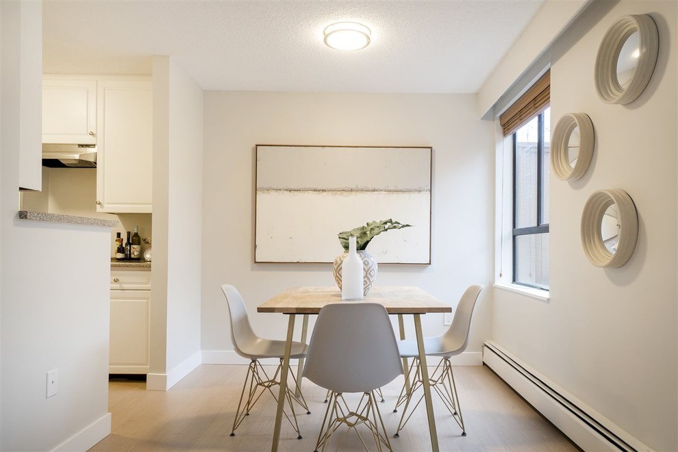 This is an example of a beach style dining room in Vancouver.