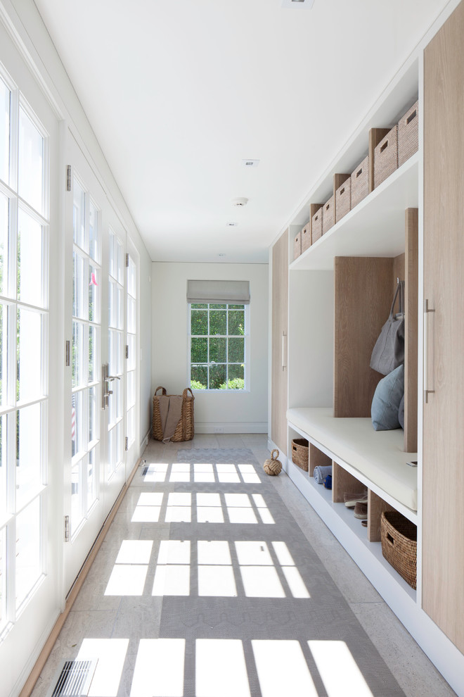 Design ideas for a mid-sized beach style mudroom in Boston with white walls, ceramic floors, a double front door and a white front door.