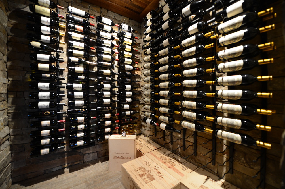 Wine cellar - mid-sized transitional light wood floor wine cellar idea with storage racks