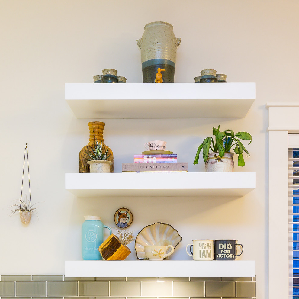 Inspiration for a large transitional u-shaped light wood floor open concept kitchen remodel with a farmhouse sink, shaker cabinets, blue cabinets, quartz countertops, gray backsplash, glass tile backsplash, stainless steel appliances, an island and white countertops
