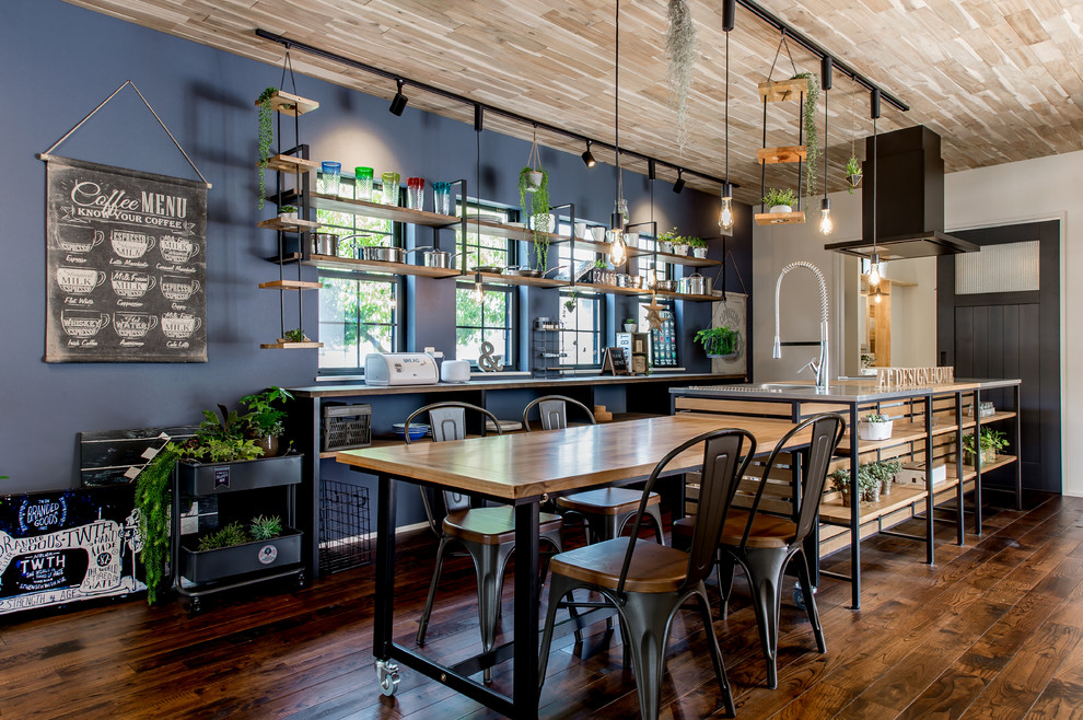 Design ideas for an industrial dining room in Osaka with blue walls and dark hardwood floors.