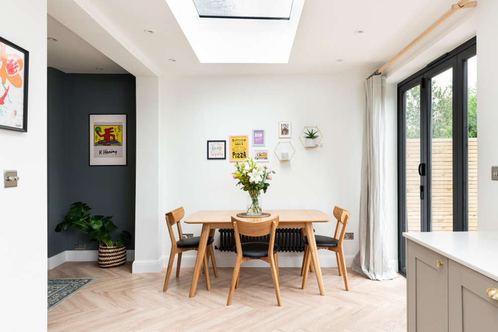 Design ideas for a medium sized modern open plan dining room in London.