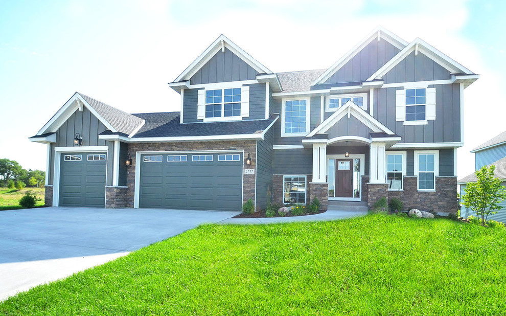 Example of a large transitional two-story gray home design design in Minneapolis