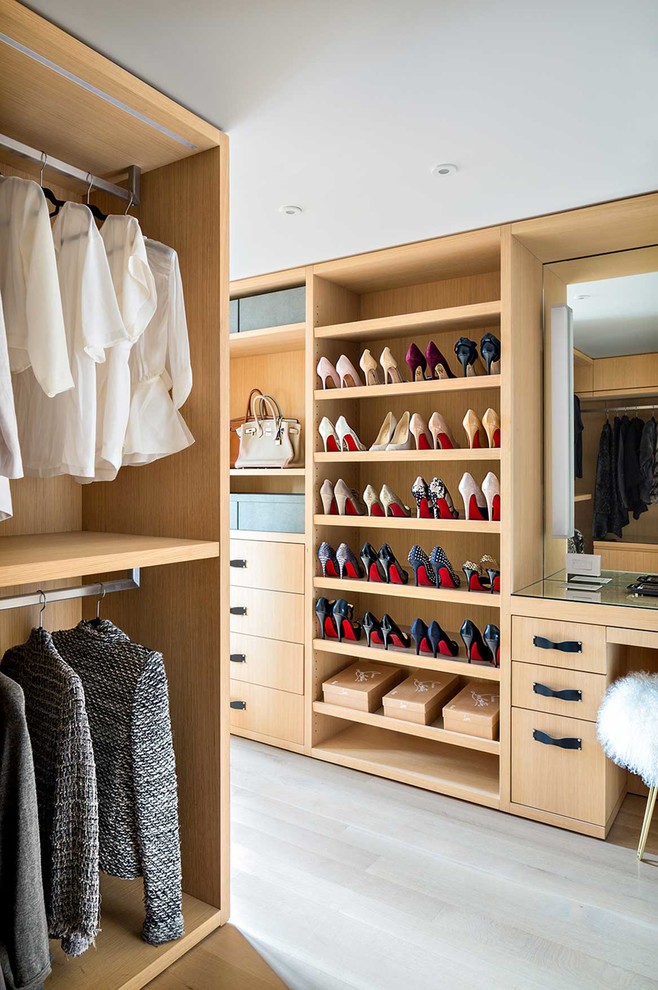 Contemporary storage and wardrobe in New York with grey floor.