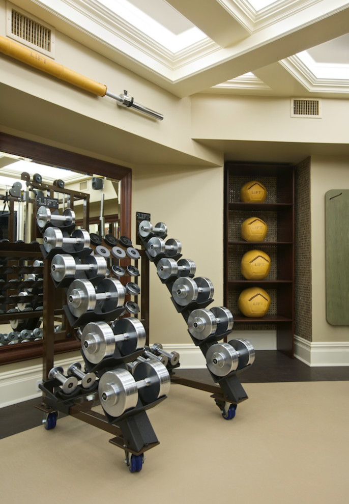 Inspiration for a large timeless coffered ceiling home weight room remodel in New York with beige walls