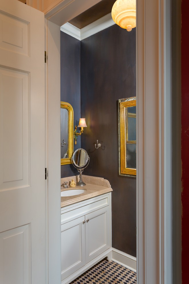 This is an example of a small traditional bathroom in New Orleans with an undermount sink, flat-panel cabinets, white cabinets, marble benchtops, multi-coloured tile, stone tile, marble floors and grey walls.