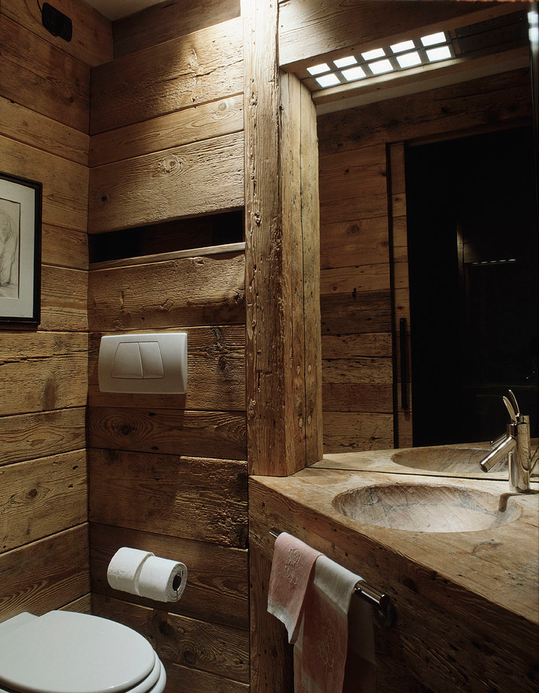 Design ideas for a country bathroom in Venice with an integrated sink, wood benchtops and a one-piece toilet.