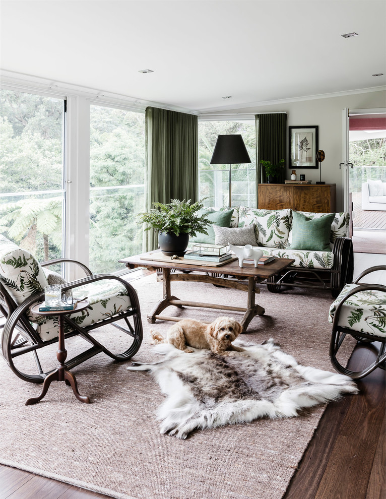 This is an example of a large eclectic sunroom in Sydney with dark hardwood floors and a standard ceiling.