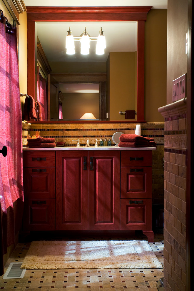 Small traditional master bathroom in Milwaukee with raised-panel cabinets, red cabinets, stone tile, multi-coloured walls, mosaic tile floors, an undermount sink, marble benchtops, beige tile and brown tile.