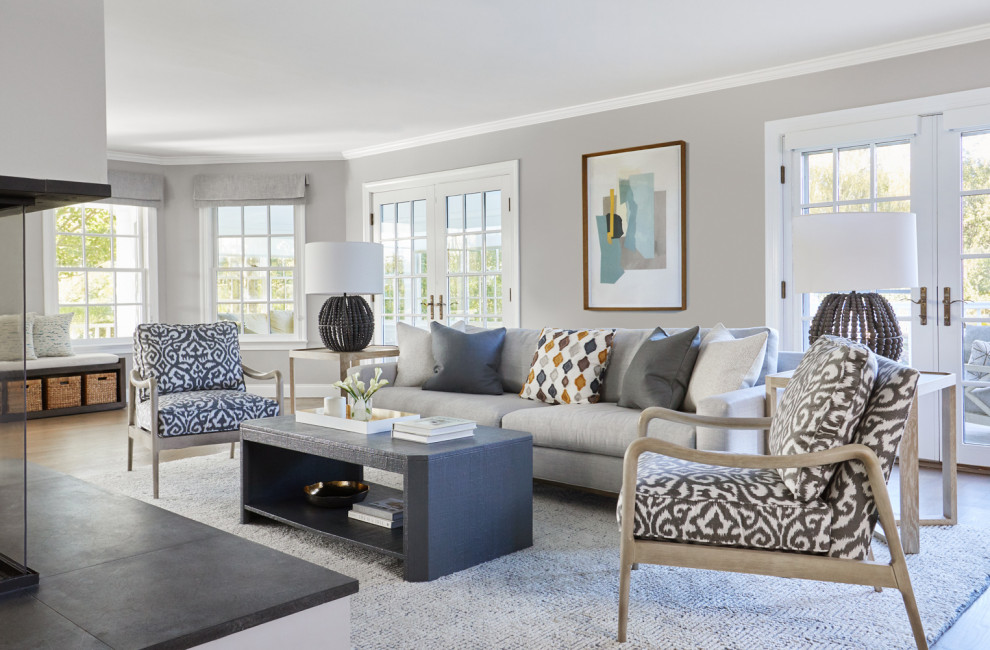 Medium sized coastal formal enclosed living room in New York with medium hardwood flooring, no tv and no fireplace.