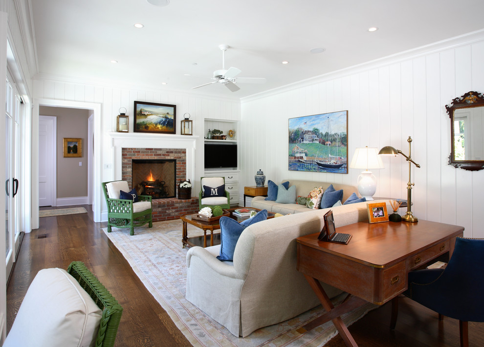 Design ideas for a beach style family room in San Francisco with white walls, dark hardwood floors, a standard fireplace and a brick fireplace surround.