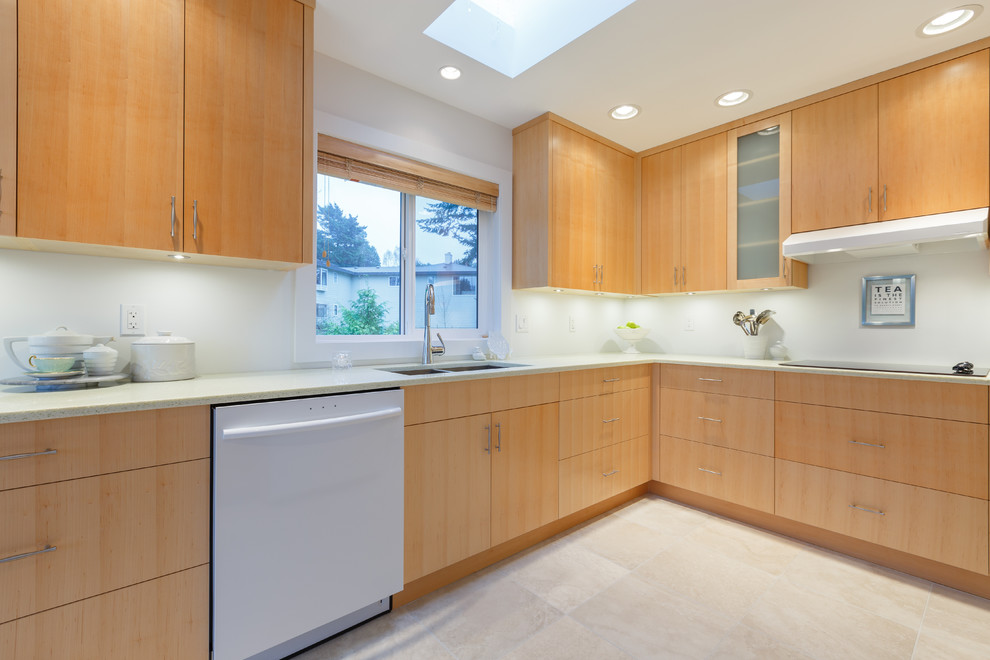 Inspiration for a mid-sized modern l-shaped separate kitchen in Vancouver with an undermount sink, flat-panel cabinets, light wood cabinets, recycled glass benchtops, white splashback, white appliances, porcelain floors and no island.