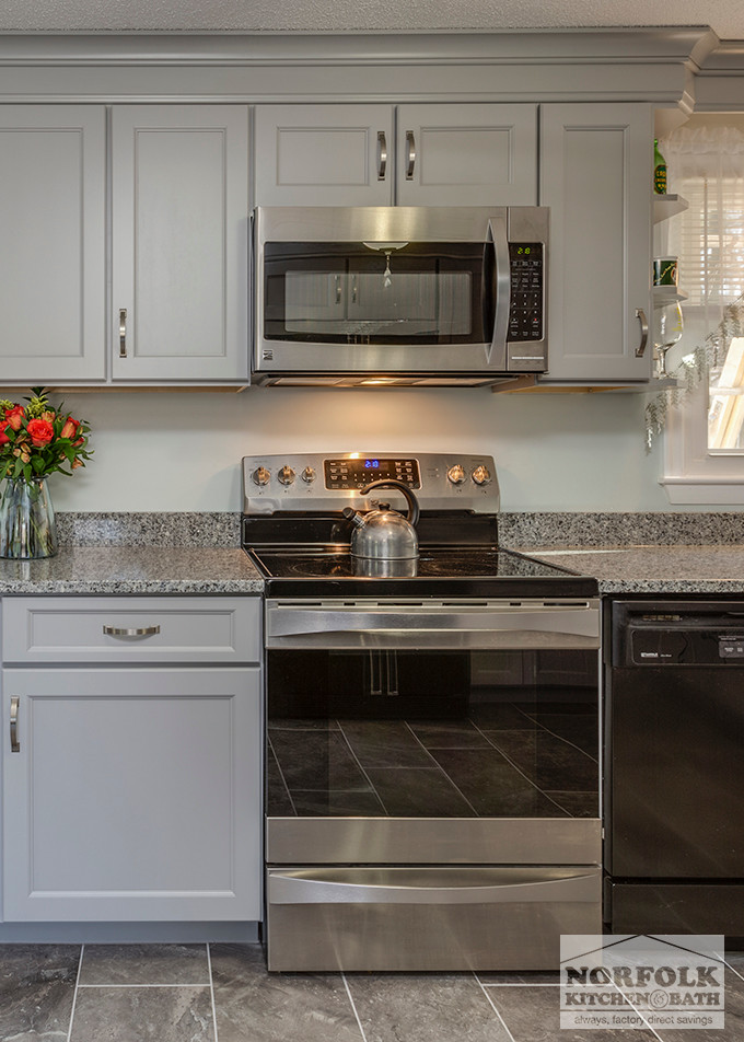 Inspiration for a mid-sized transitional u-shaped home design remodel in Boston with an undermount sink, shaker cabinets, gray cabinets, granite countertops, stainless steel appliances and no island