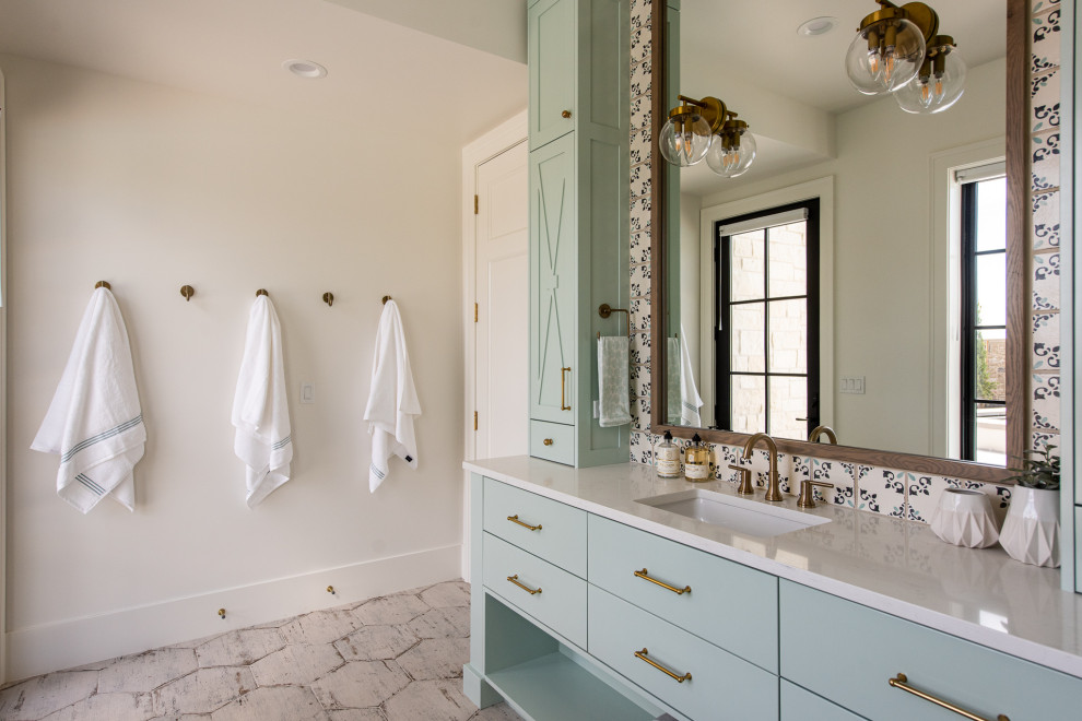 Inspiration for a transitional bathroom in Salt Lake City with flat-panel cabinets, blue cabinets, white walls, an undermount sink, grey floor, white benchtops, a single vanity and a built-in vanity.