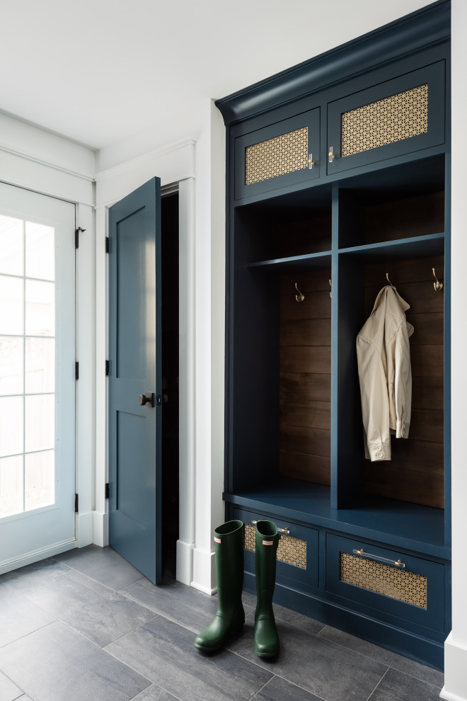 Mid-sized country mudroom in Chicago with white walls, porcelain floors, a single front door, a glass front door and grey floor.