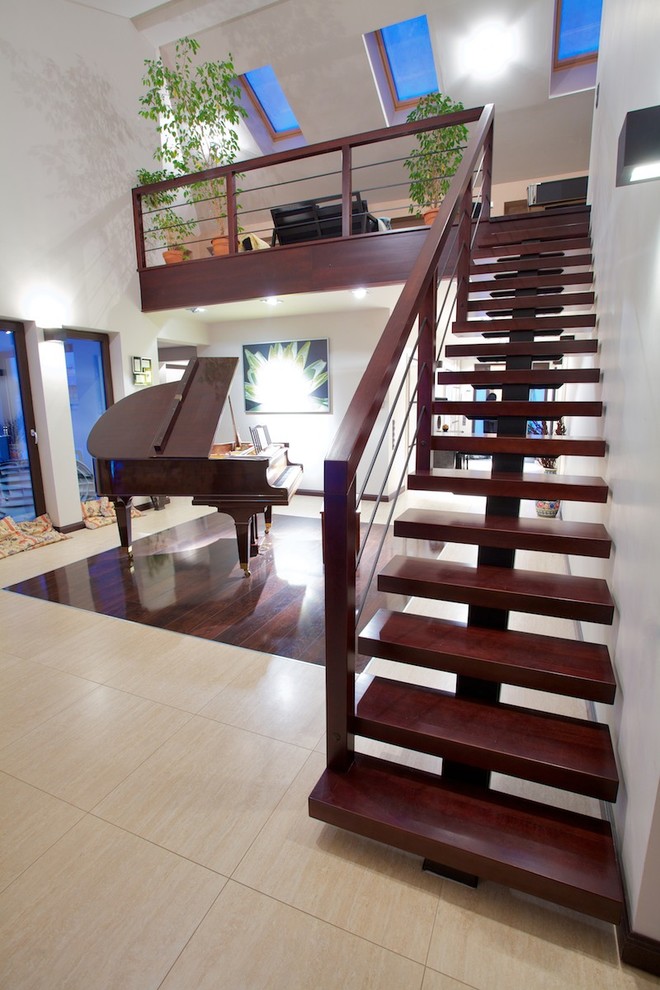 Design ideas for a large contemporary wood straight staircase in Other with open risers.