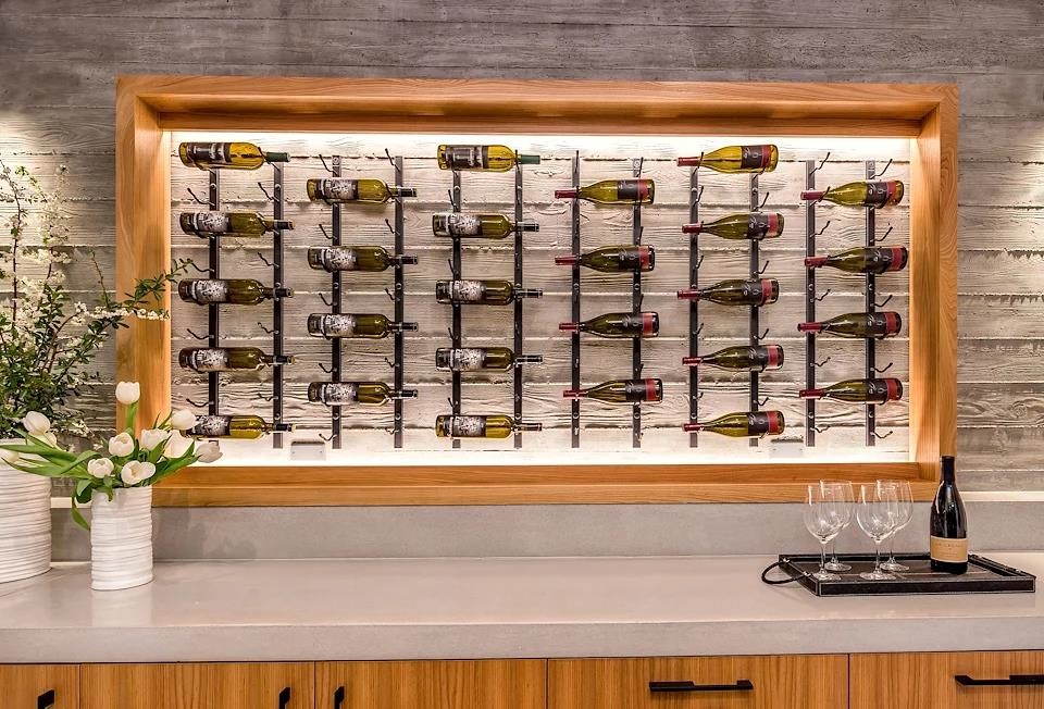 Design ideas for a large modern wine cellar in San Francisco with porcelain floors, display racks and beige floor.