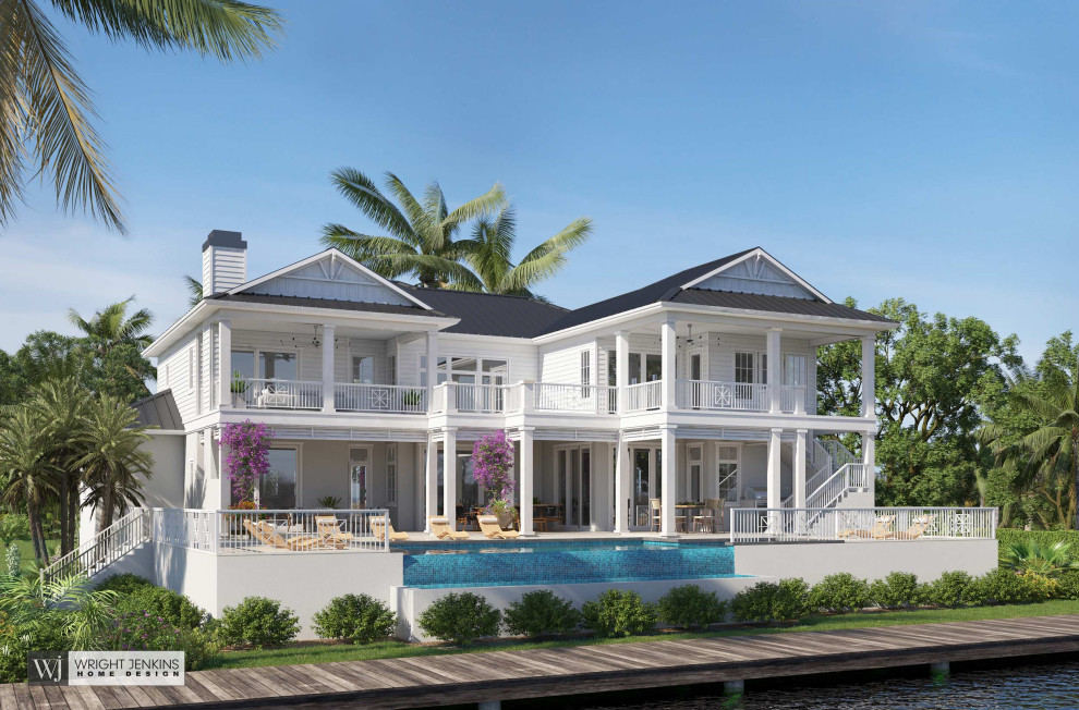 Идея дизайна: двухэтажный, белый частный загородный дом среднего размера в морском стиле с комбинированной облицовкой, вальмовой крышей, металлической крышей, черной крышей и отделкой планкеном