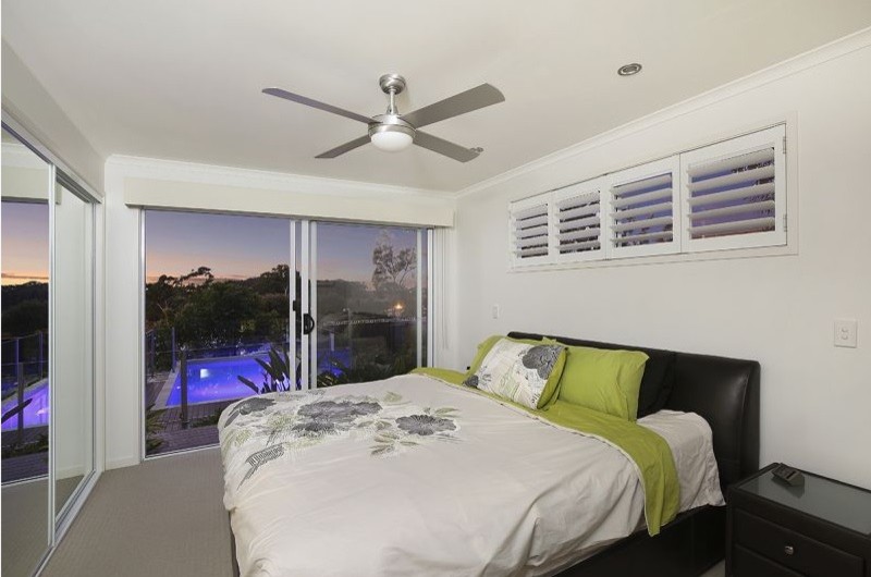 This is an example of a bedroom in Sunshine Coast.