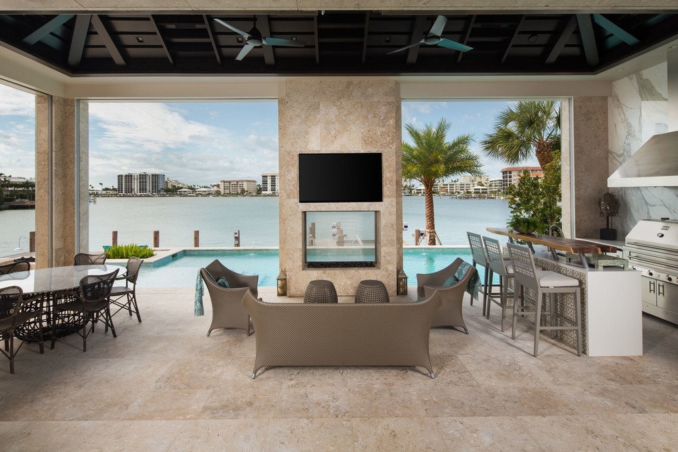 Photo of a contemporary patio in Miami with tile.