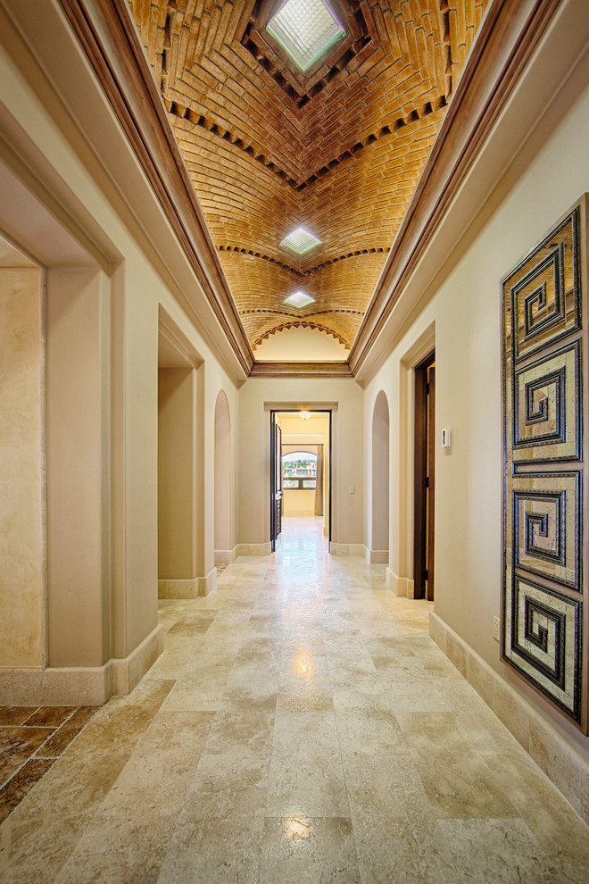 Inspiration for a mediterranean hallway in Other with beige walls.