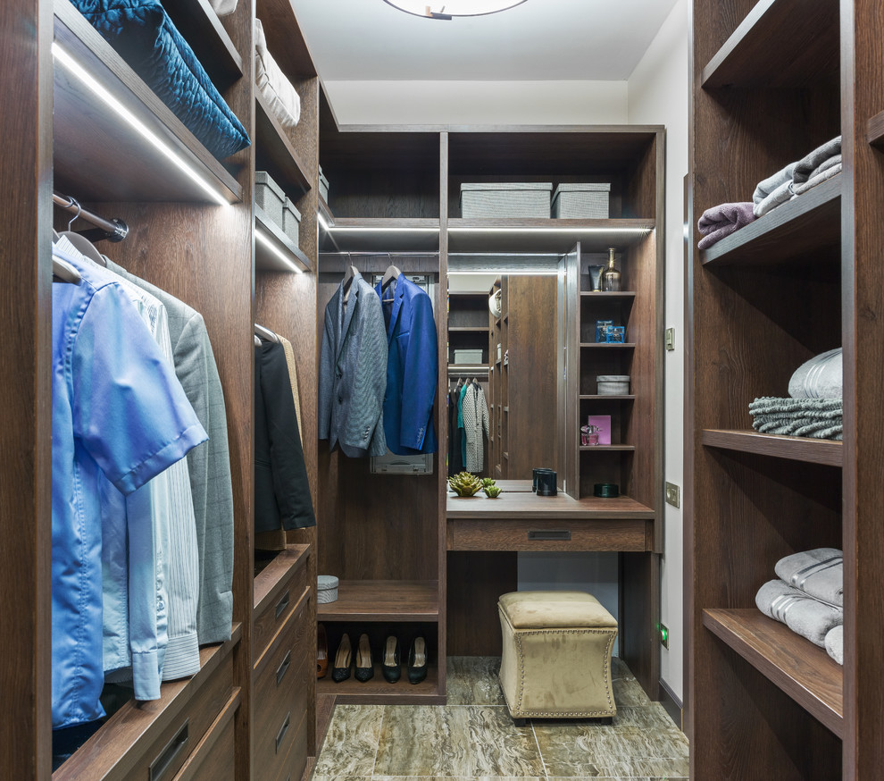 Contemporary gender-neutral dressing room in Moscow with open cabinets, dark wood cabinets and multi-coloured floor.