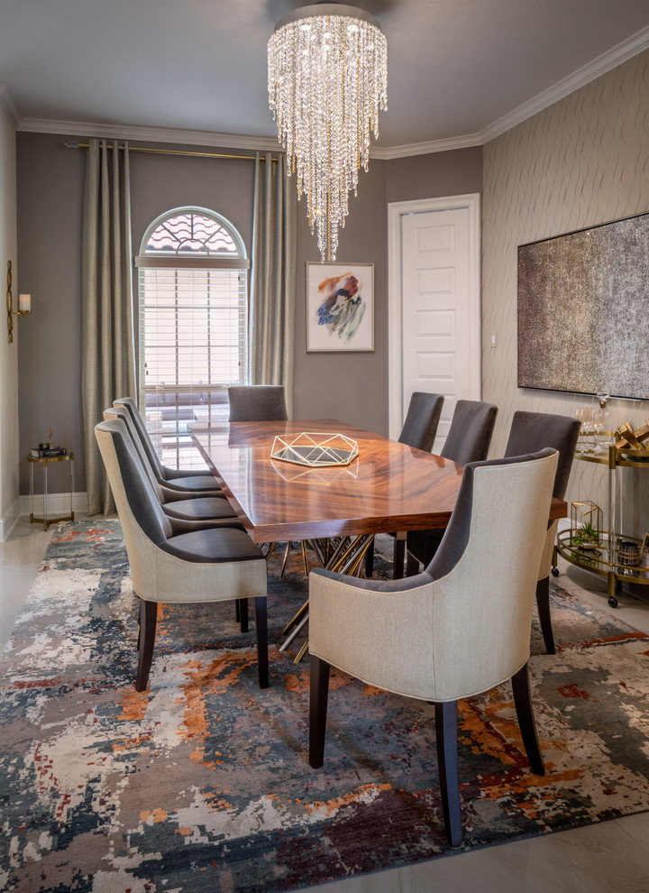 This is an example of a mid-sized transitional open plan dining in Houston with grey walls, ceramic floors, no fireplace and beige floor.